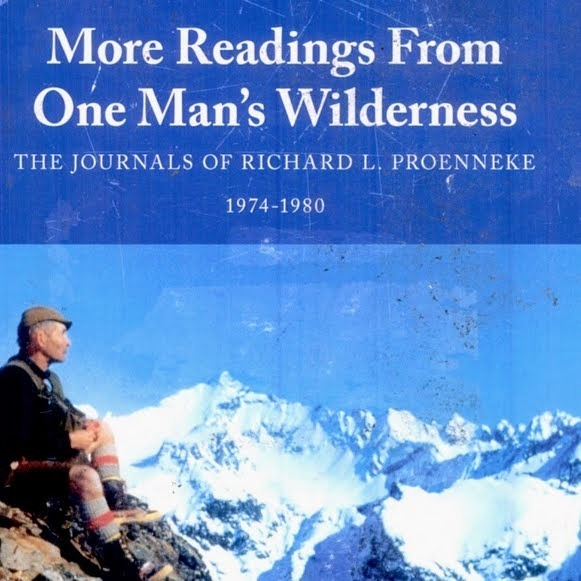 Book cover of 'More Readings From One Man's Wilderness' by Richard L. Proenneke, featuring a photograph of Proenneke sitting on a rock in the mountains, dressed for outdoor exploration.